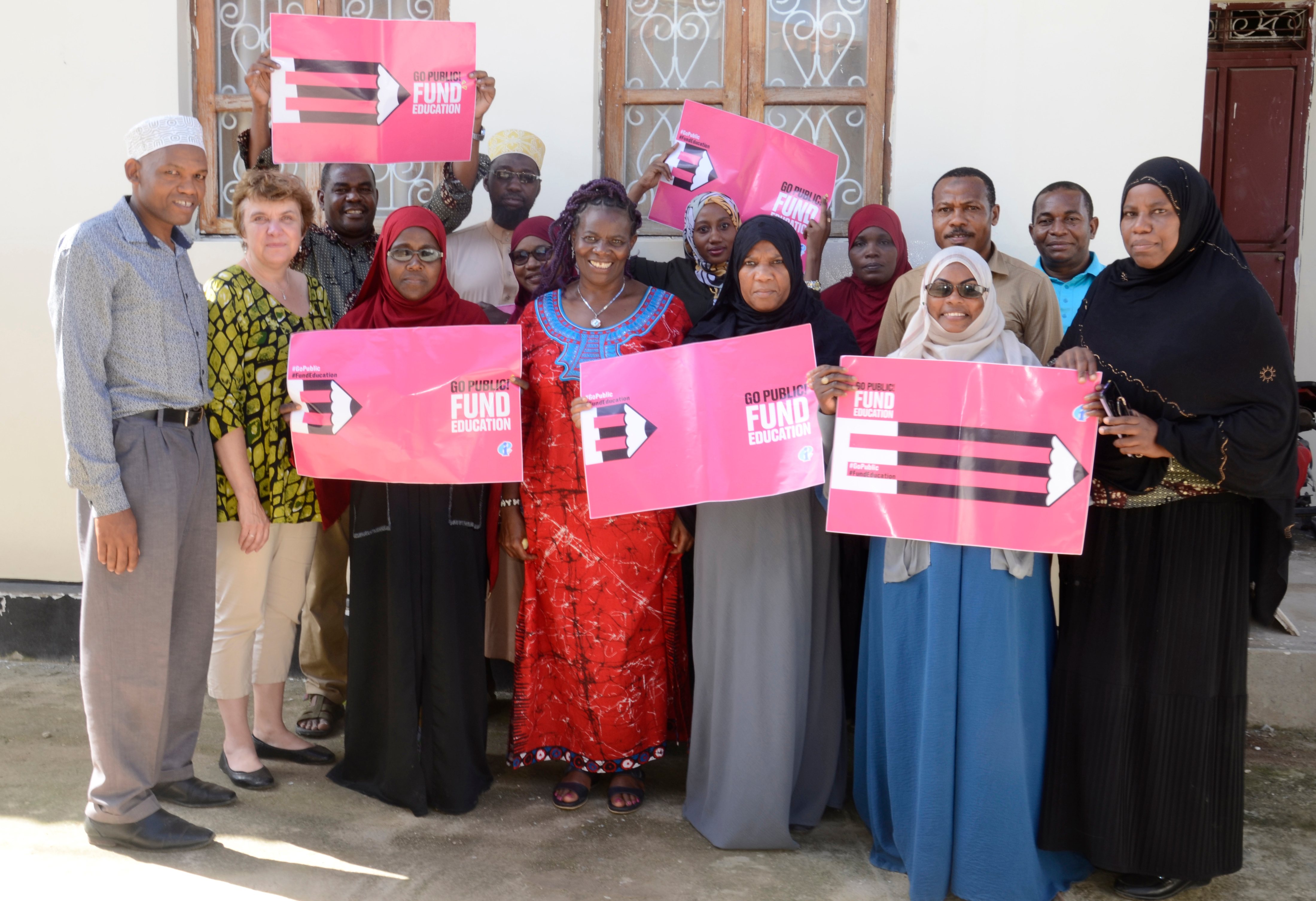 ZATU teachers holding Go Public! Fund Education campaign placards in Zanzibar